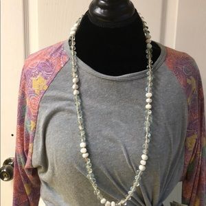 Long necklace with clear and white beads